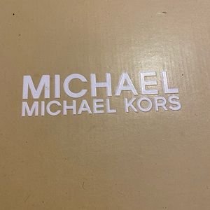 These are Michael Kor “printed haircalf” boots !